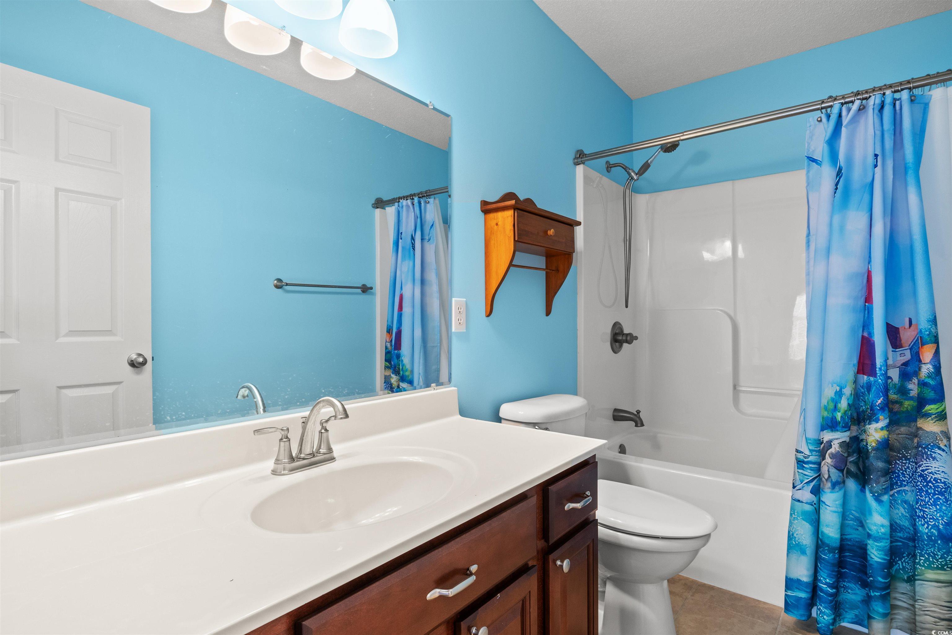 125 Dayglow Drive Loris, SC 29569 - Photo 12 of 24 Bathroom with toilet, shower / bath combo with sho