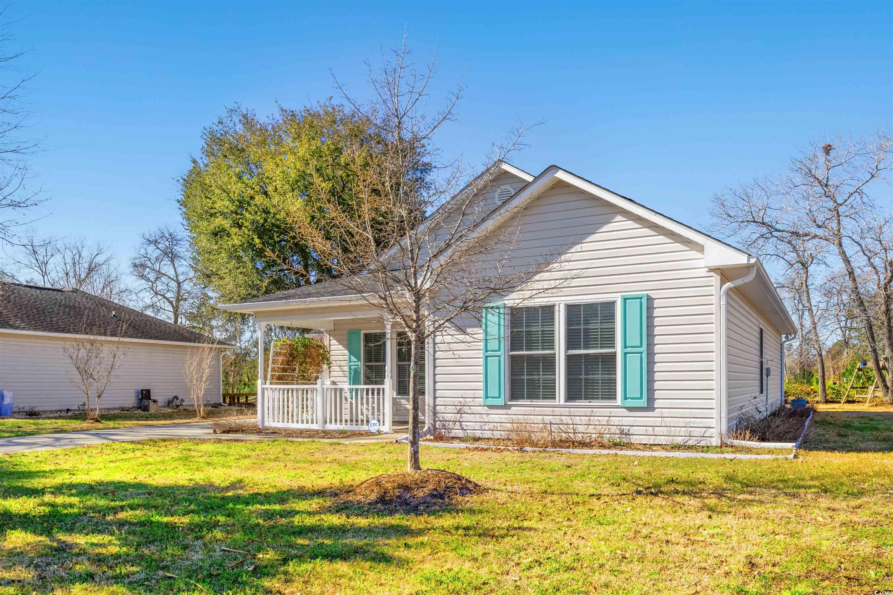 125 Dayglow Drive Loris, SC 29569 - Photo 20 of 24 View of front facade with a porch and a front lawn