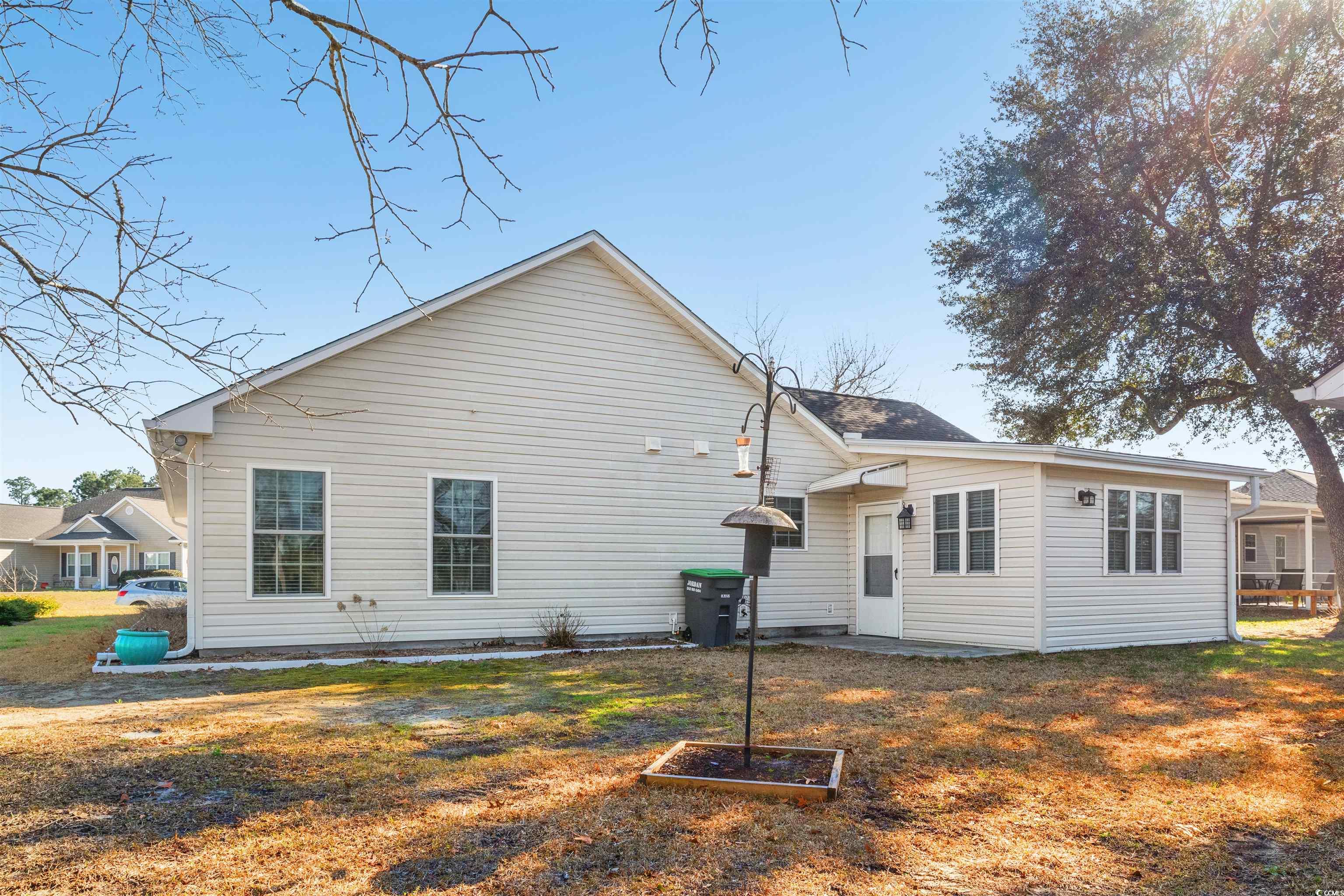125 Dayglow Drive Loris, SC 29569 - Photo 22 of 24 Back of property with a lawn