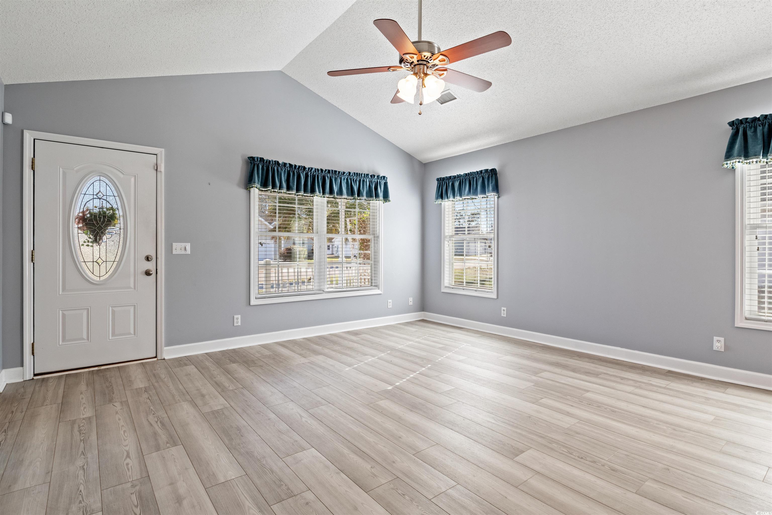 125 Dayglow Drive Loris, SC 29569 - Photo 3 of 24 Entryway featuring ceiling fan, a textured ceiling