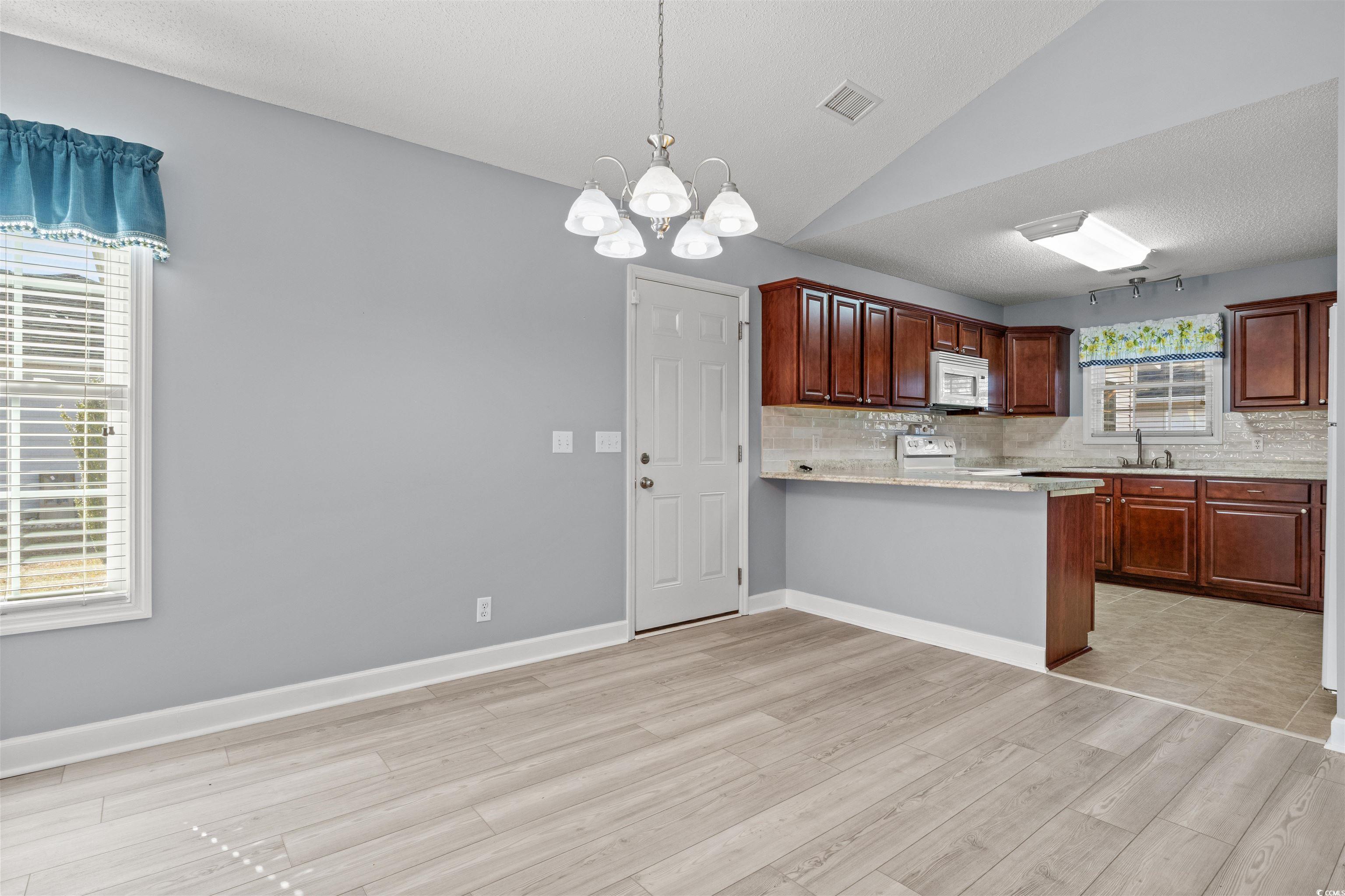 125 Dayglow Drive Loris, SC 29569 - Photo 7 of 24 Kitchen with tasteful backsplash, light countertop