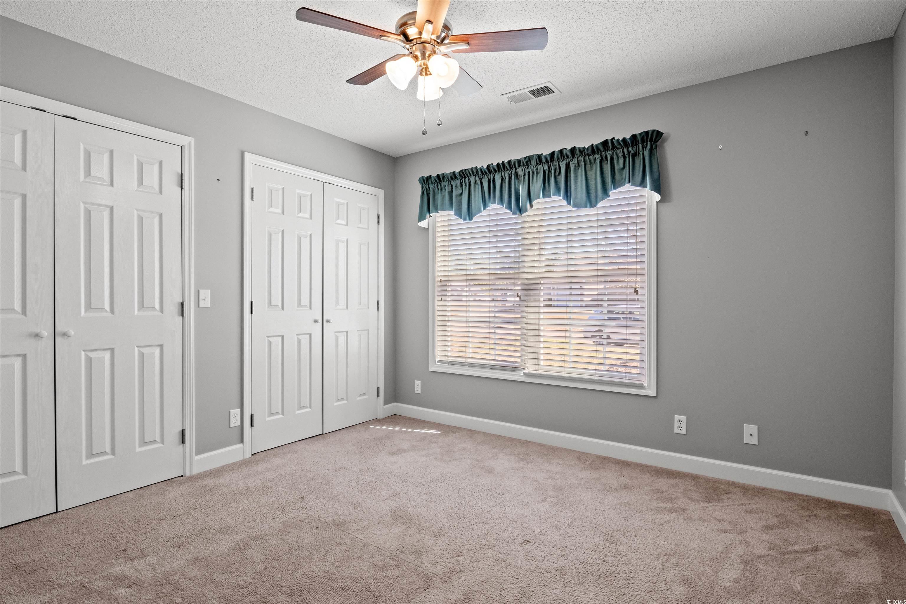 125 Dayglow Drive Loris, SC 29569 - Photo 10 of 24 Unfurnished bedroom featuring a textured ceiling,