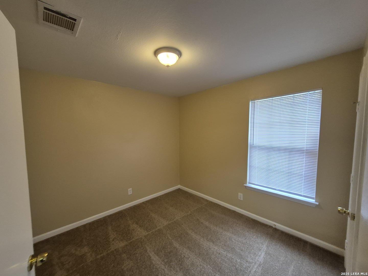 8806 Slumber Lane Converse, TX 78109 - Photo 11 of 39 an empty room with a window