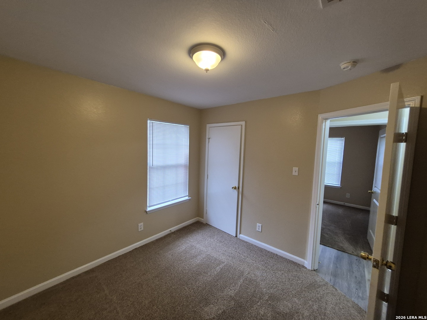 8806 Slumber Lane Converse, TX 78109 - Photo 12 of 39 an empty room with closet and mirror