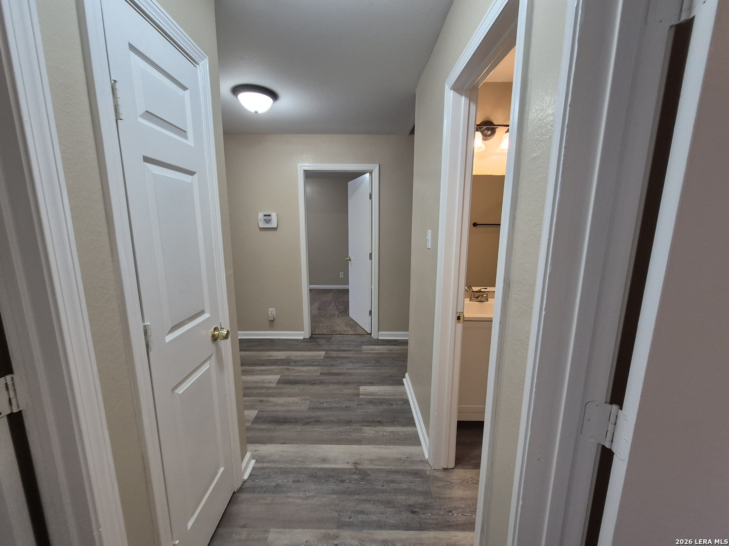 8806 Slumber Lane Converse, TX 78109 - Photo 13 of 39 a view of a hallway with wooden floor and entryway