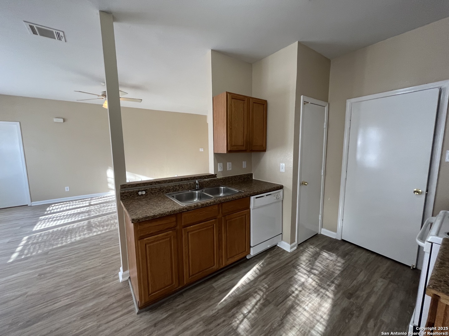 8806 Slumber Lane, Unit 101 Converse, TX 78109 - Photo 15 of 38 a kitchen with stainless steel appliances granite countertop a stove and a refrigerator