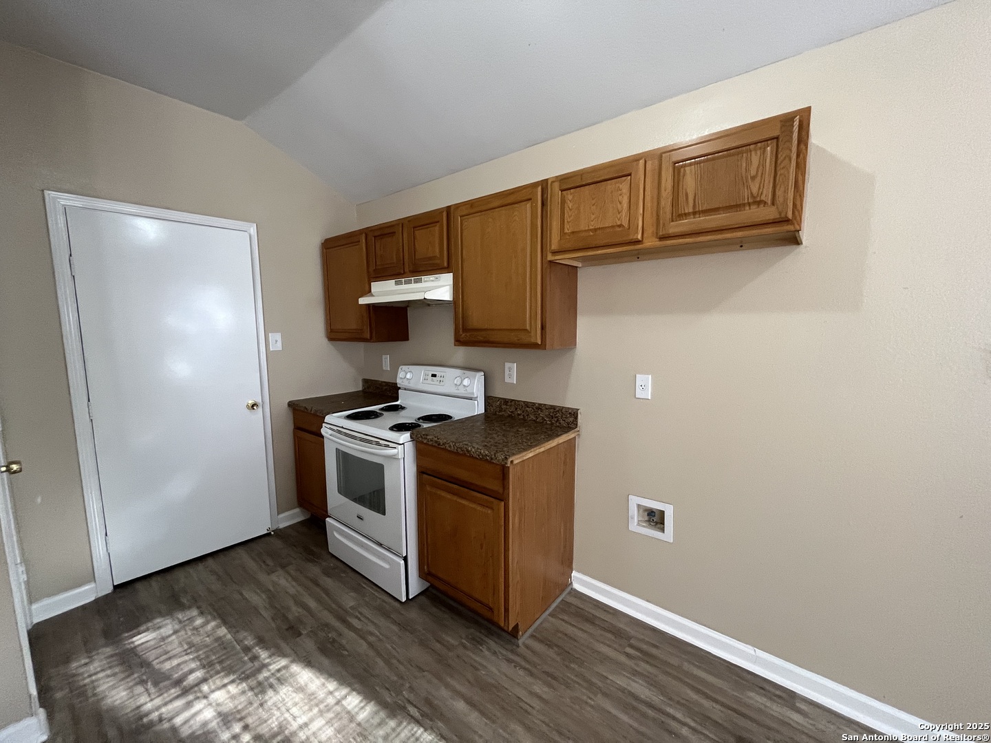 8806 Slumber Lane, Unit 101 Converse, TX 78109 - Photo 16 of 38 a kitchen with a stove and a microwave