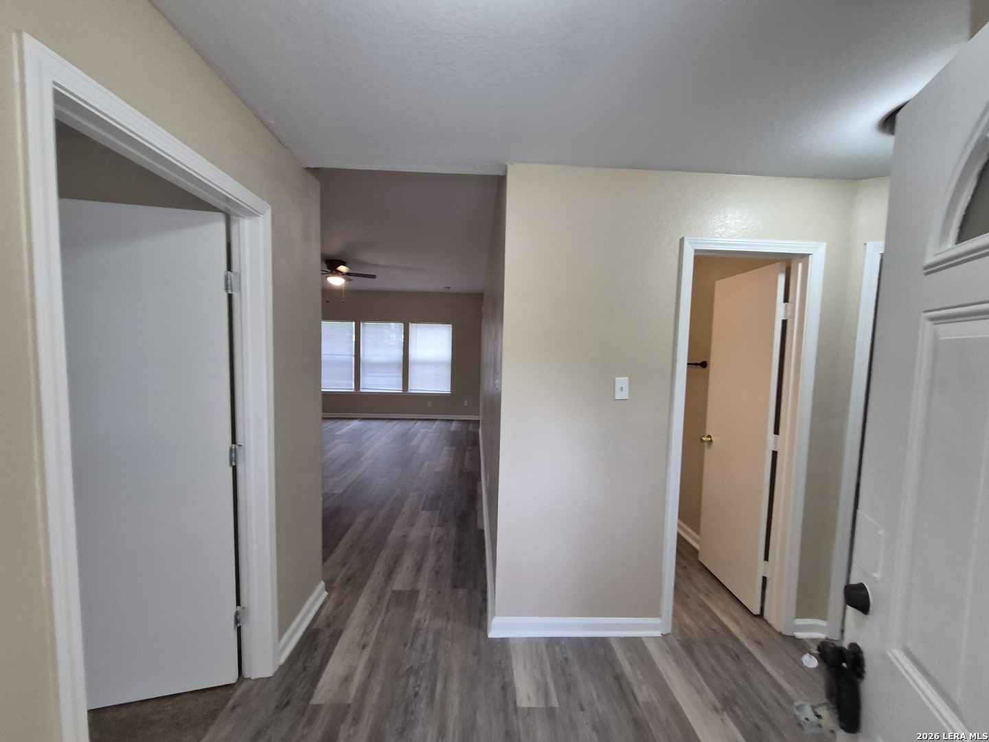 8806 Slumber Lane Converse, TX 78109 - Photo 2 of 39 a view of a hallway with wooden floor