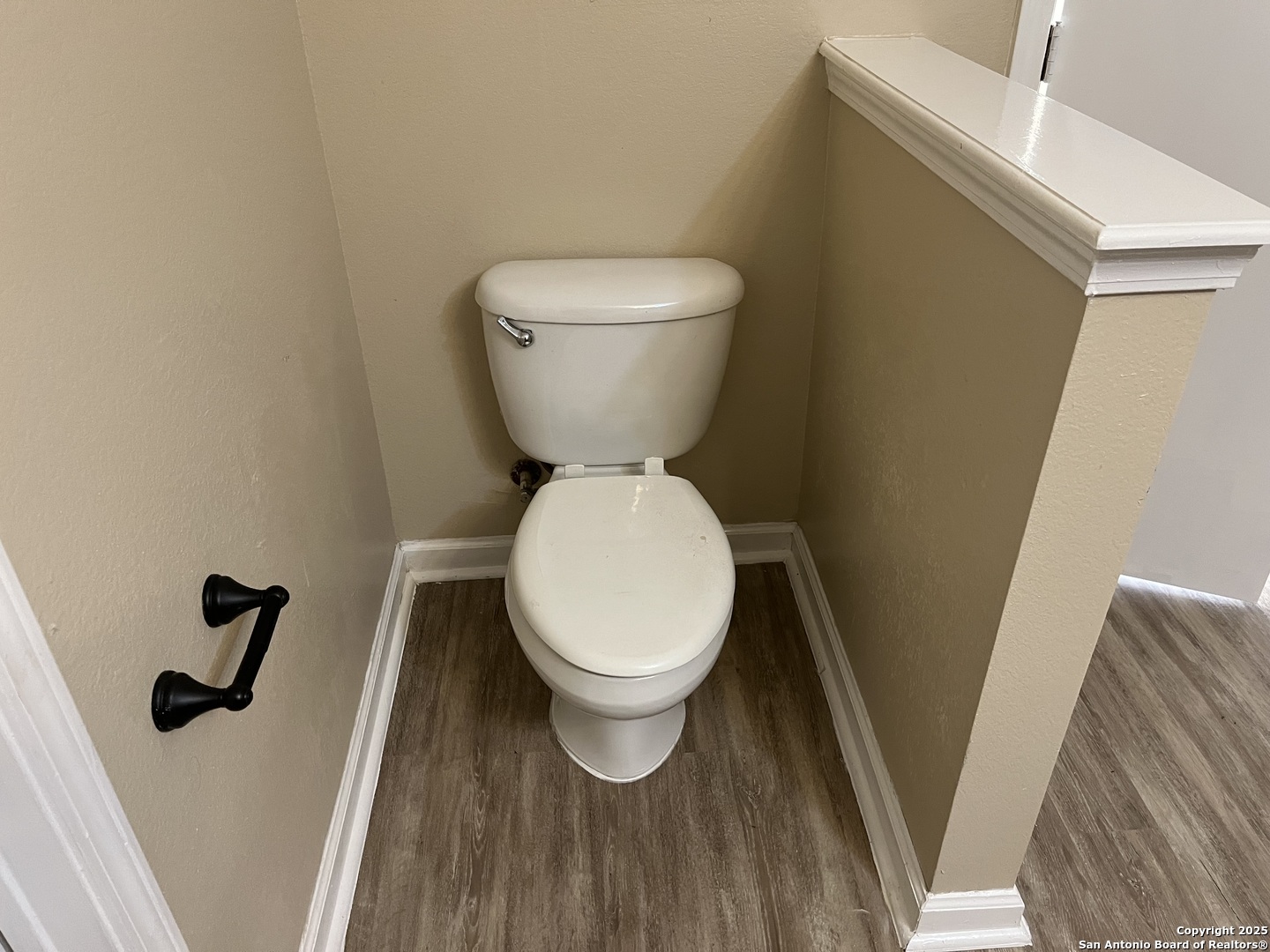 8806 Slumber Lane, Unit 101 Converse, TX 78109 - Photo 24 of 38 a white toilet sitting next to a sink