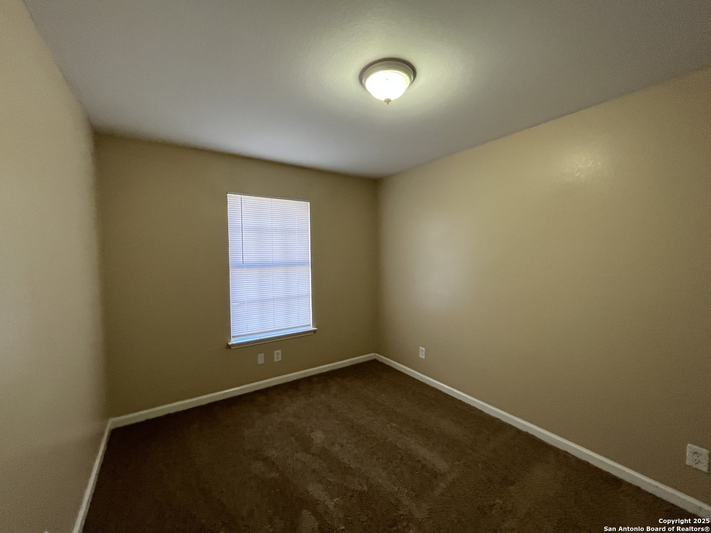 8806 Slumber Lane, Unit 101 Converse, TX 78109 - Photo 25 of 38 an empty room with a window