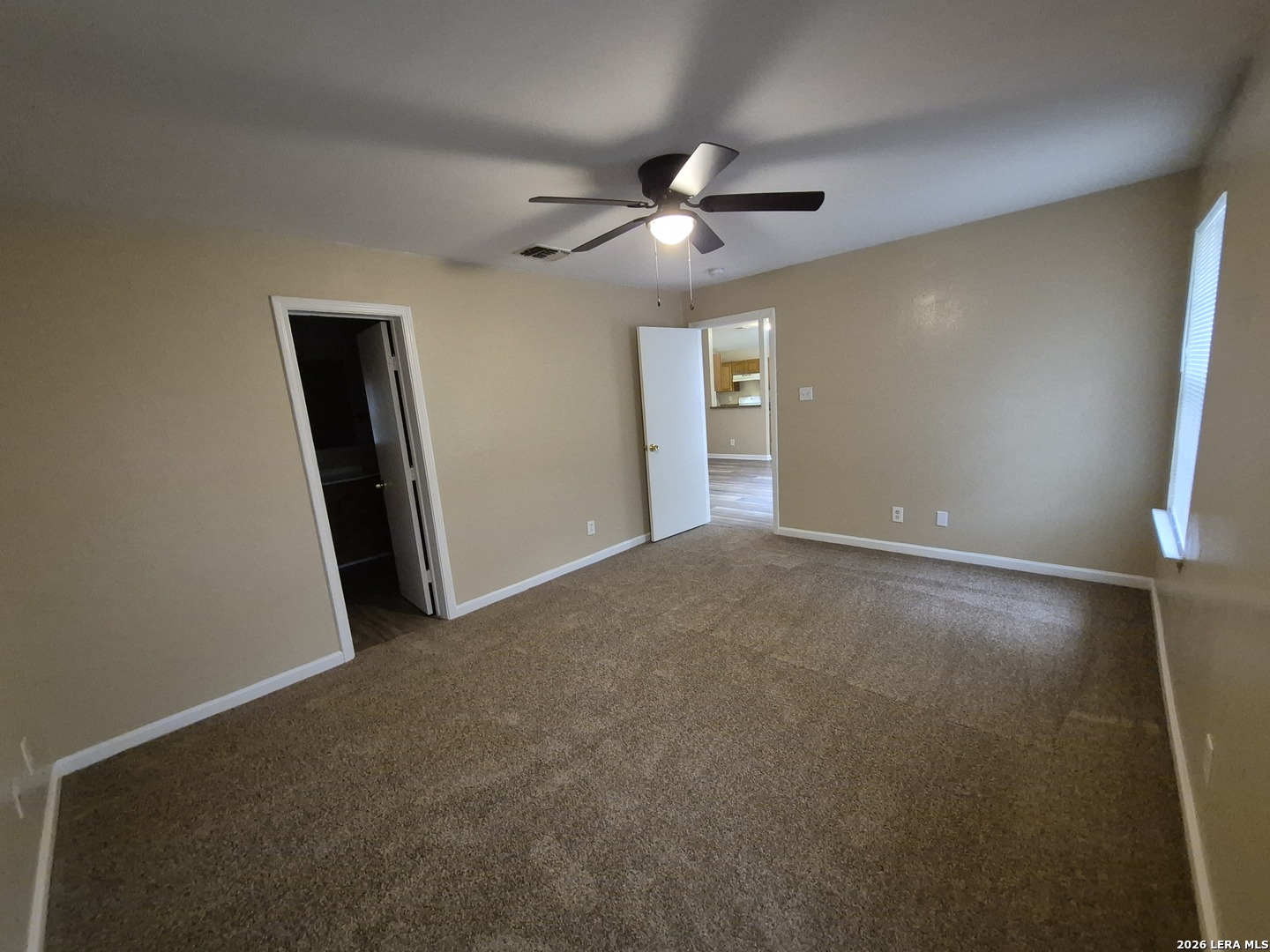 8806 Slumber Lane Converse, TX 78109 - Photo 26 of 39 a view of a livingroom with a ceiling fan and window