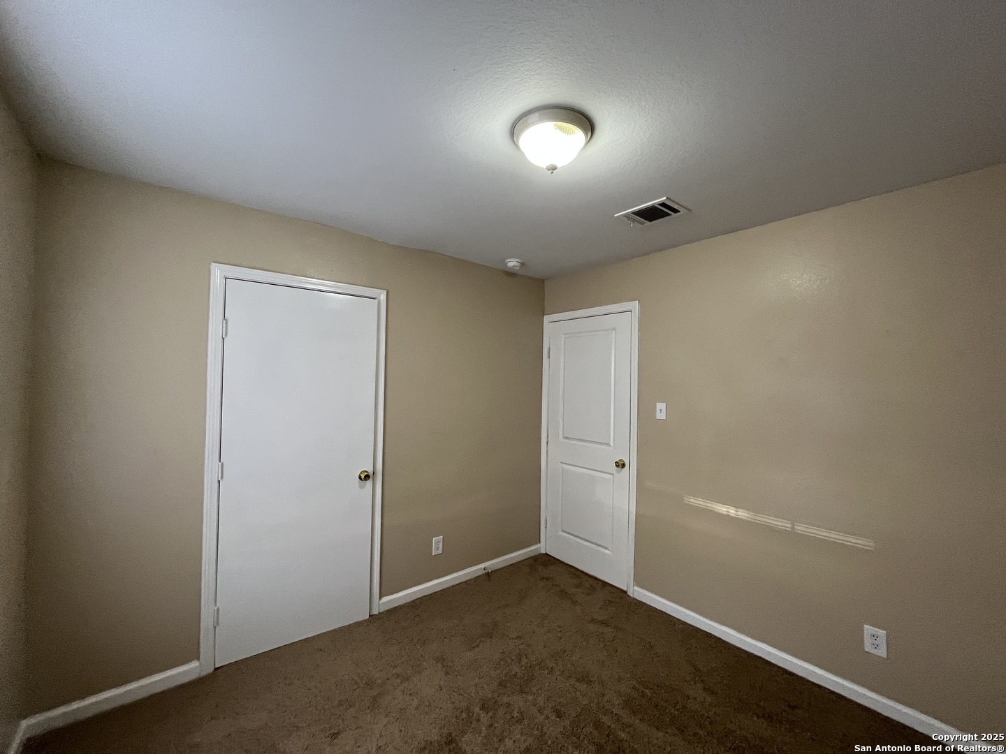 8806 Slumber Lane, Unit 101 Converse, TX 78109 - Photo 31 of 38 an empty room with an entryway