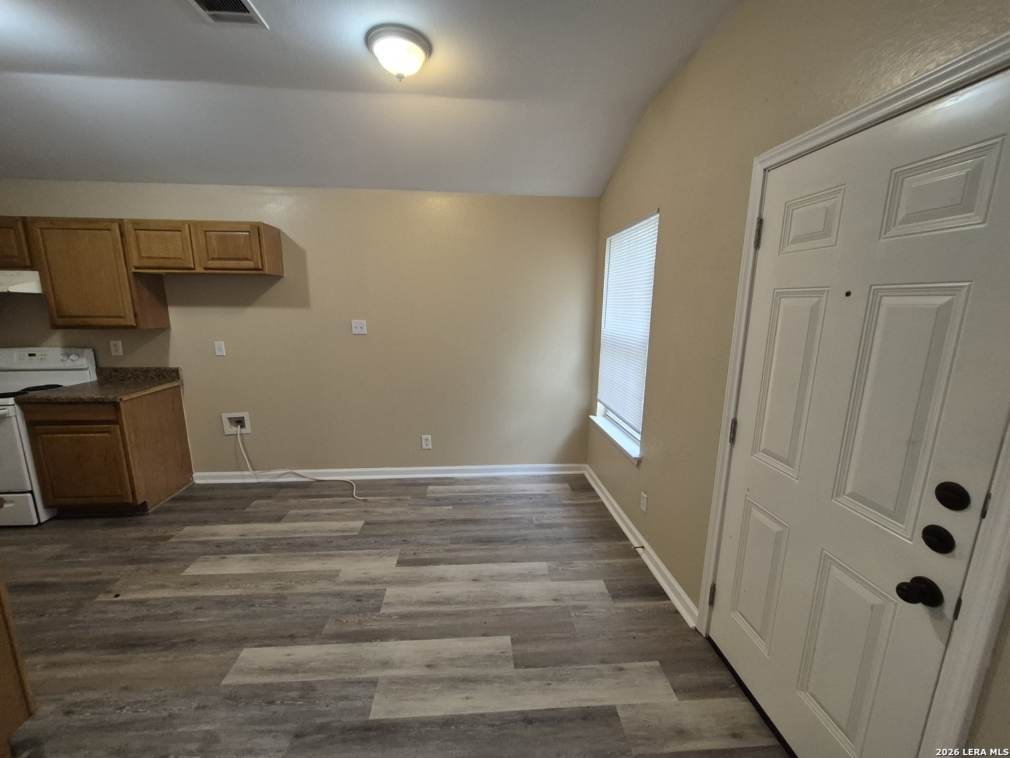 8806 Slumber Lane Converse, TX 78109 - Photo 33 of 39 a view of a kitchen with wooden floor and electronic appliances