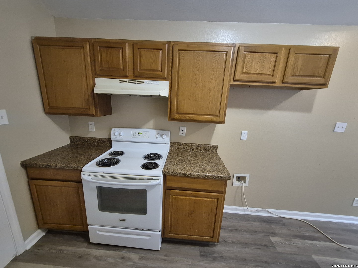 8806 Slumber Lane Converse, TX 78109 - Photo 37 of 39 a kitchen with a stove and a cabinet
