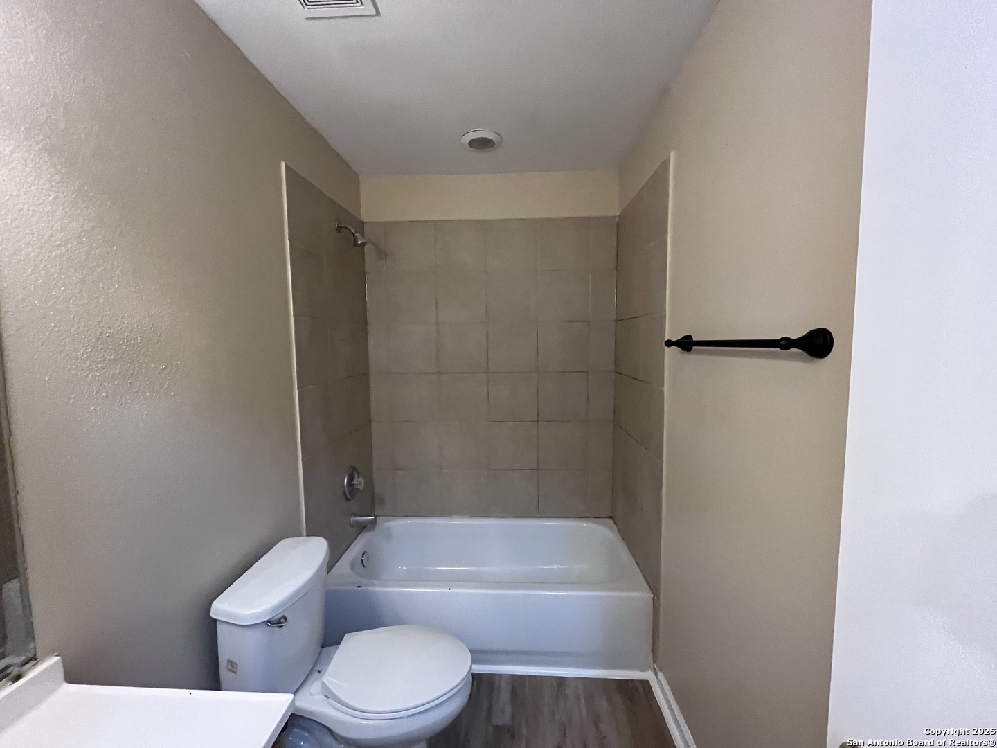 8806 Slumber Lane, Unit 101 Converse, TX 78109 - Photo 37 of 38 a white toilet sitting next to a bath tub