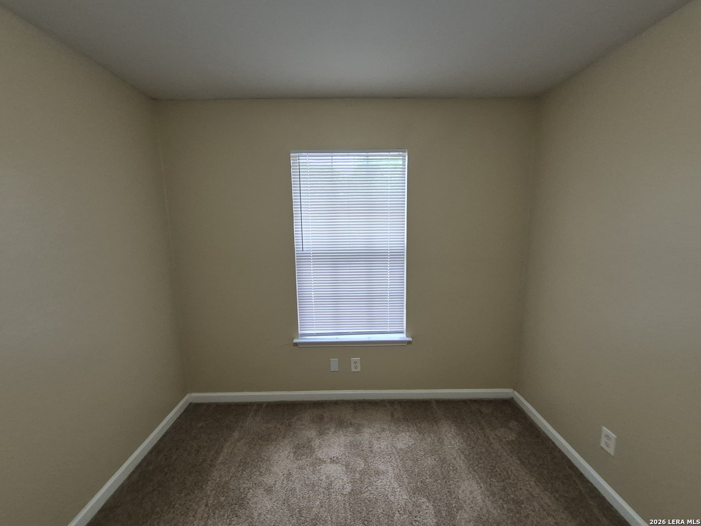 8806 Slumber Lane Converse, TX 78109 - Photo 7 of 39 an empty room with a window