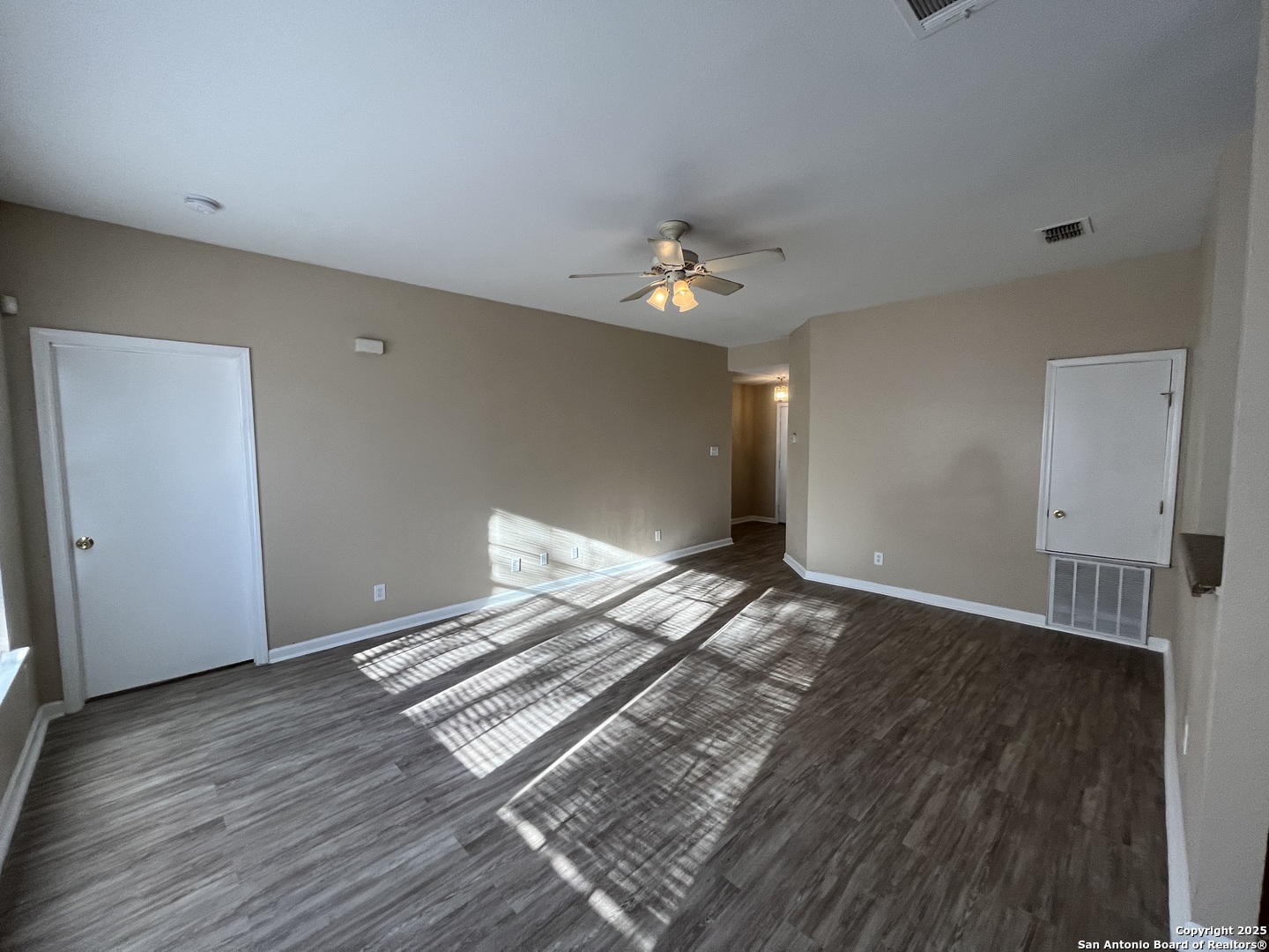 8806 Slumber Lane, Unit 101 Converse, TX 78109 - Photo 8 of 38 a view of an empty room with wooden floor