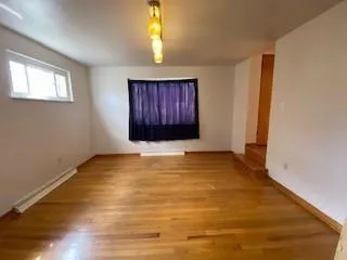 a view of an empty room and window