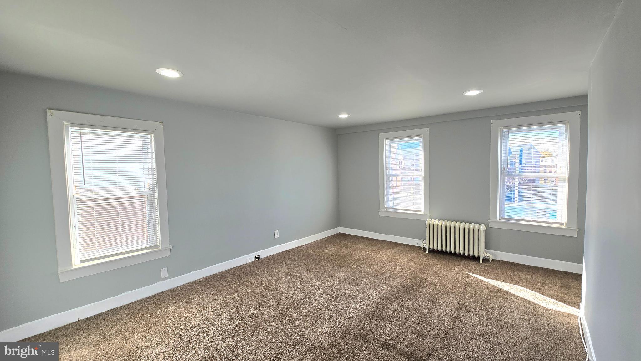 141 Bridgeboro Street, Unit 2 Riverside, NJ 08075 - Photo 4 of 7 an empty room with windows