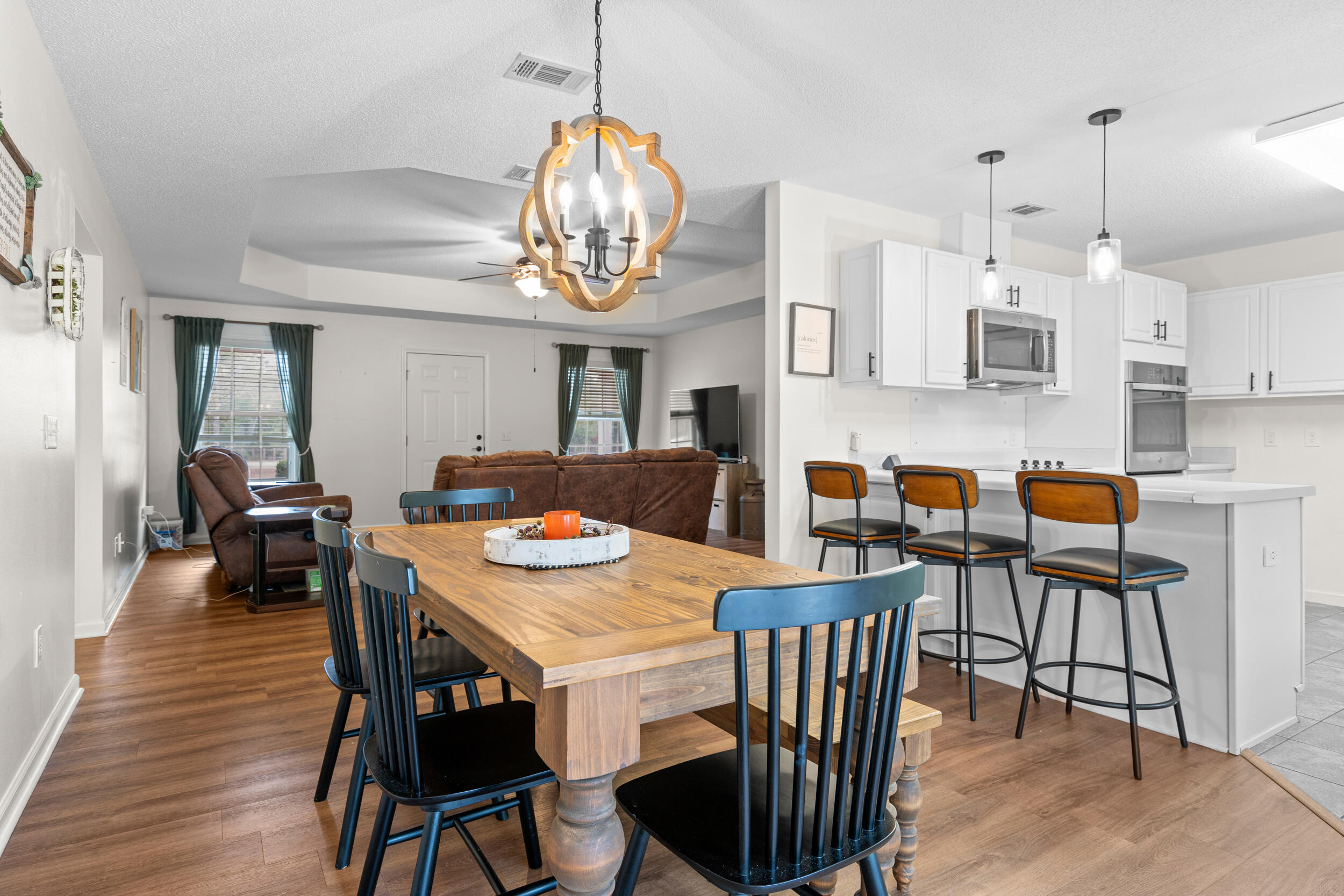 5570 Mt Olive Road Crestview, FL 32539 - Photo 15 of 57 a view of a dining room with furniture wooden floor and chandelier