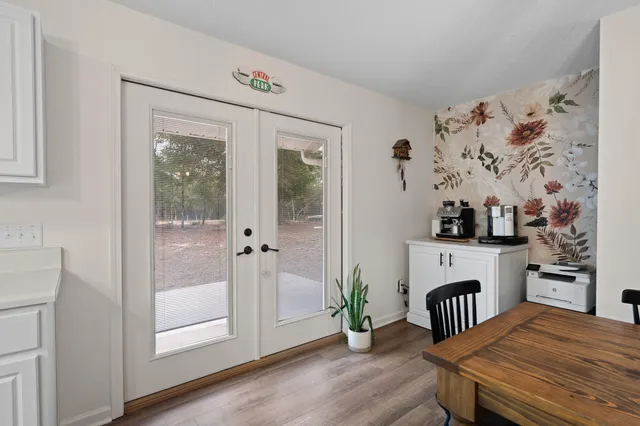 a kitchen with stainless steel appliances a refrigerator sink and cabinets