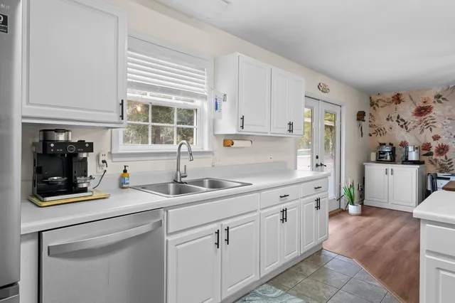 a kitchen with a sink and cabinets