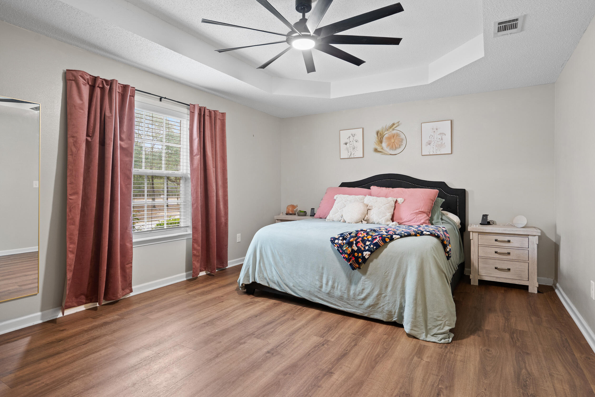 5570 Mt Olive Road Crestview, FL 32539 - Photo 29 of 57 a bedroom with a bed and wooden floor