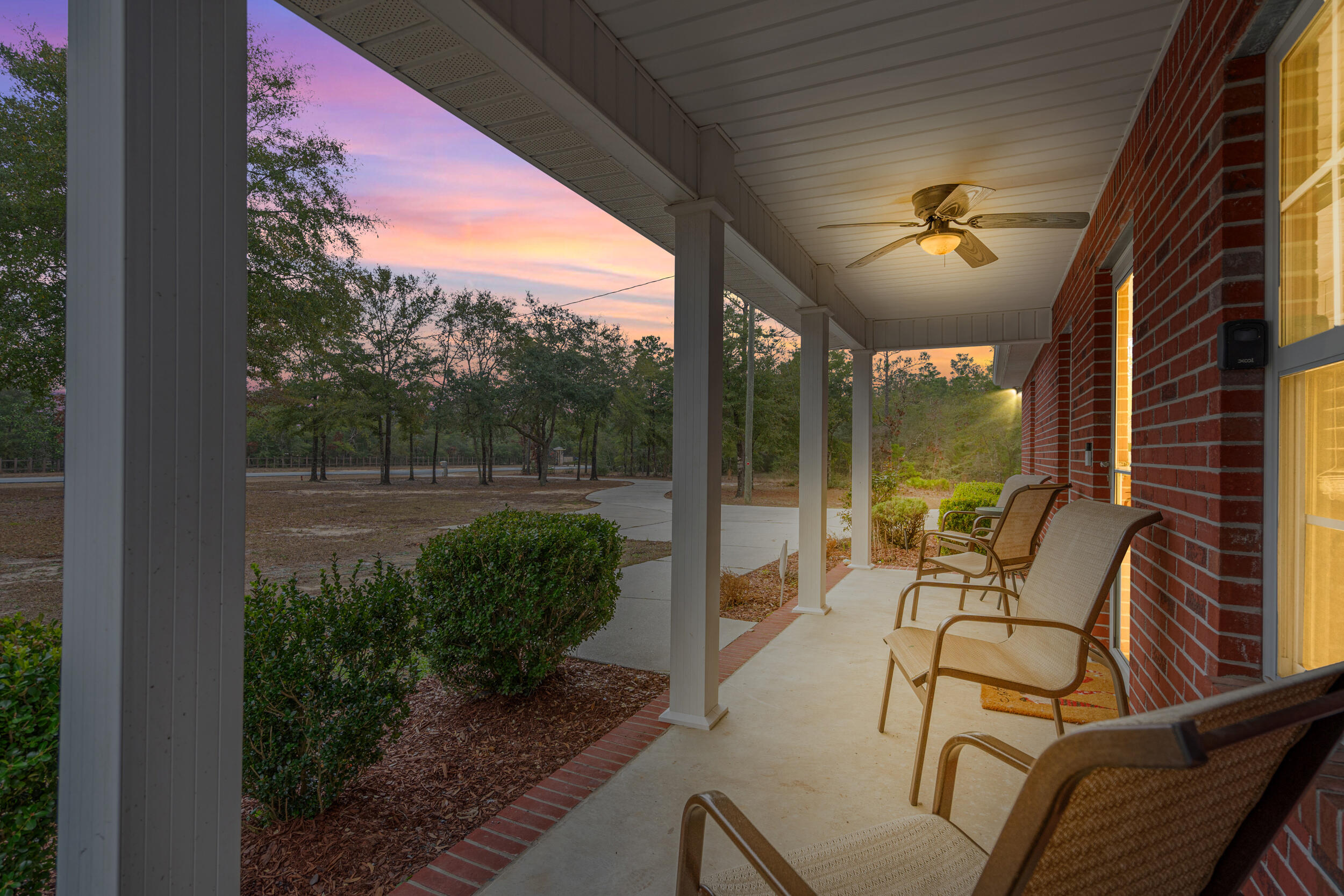 5570 Mt Olive Road Crestview, FL 32539 - Photo 3 of 57 a view of a chair and tables in the balcony