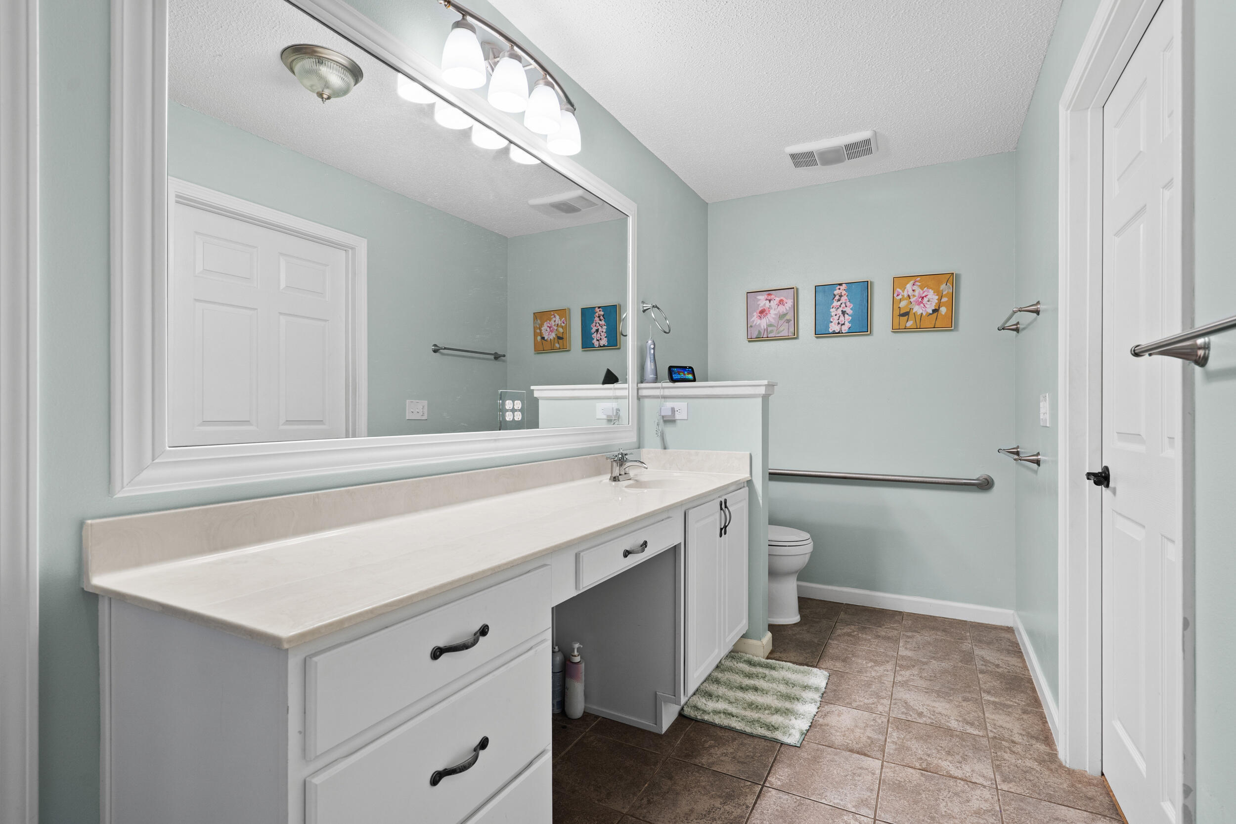 5570 Mt Olive Road Crestview, FL 32539 - Photo 33 of 57 a bathroom with a sink a toilet and a mirror