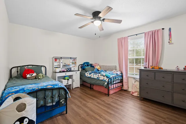 a view of patio with chairs and tables