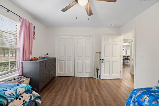 a view of a patio with table and chairs and potted plants