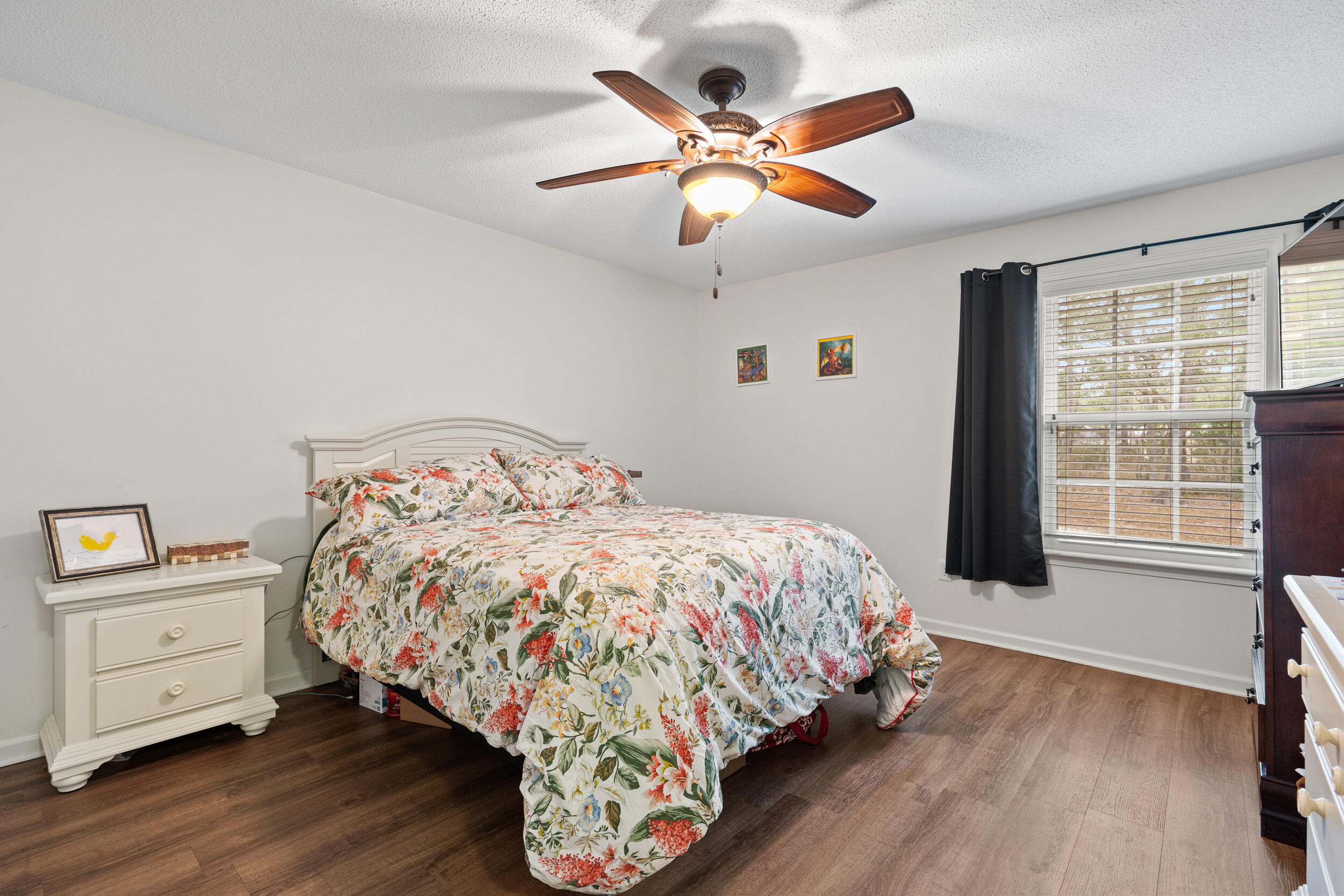 5570 Mt Olive Road Crestview, FL 32539 - Photo 37 of 57 a bedroom with a large bed and a large window