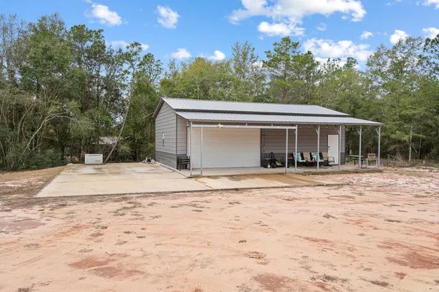 an aerial view of residential house with outdoor space