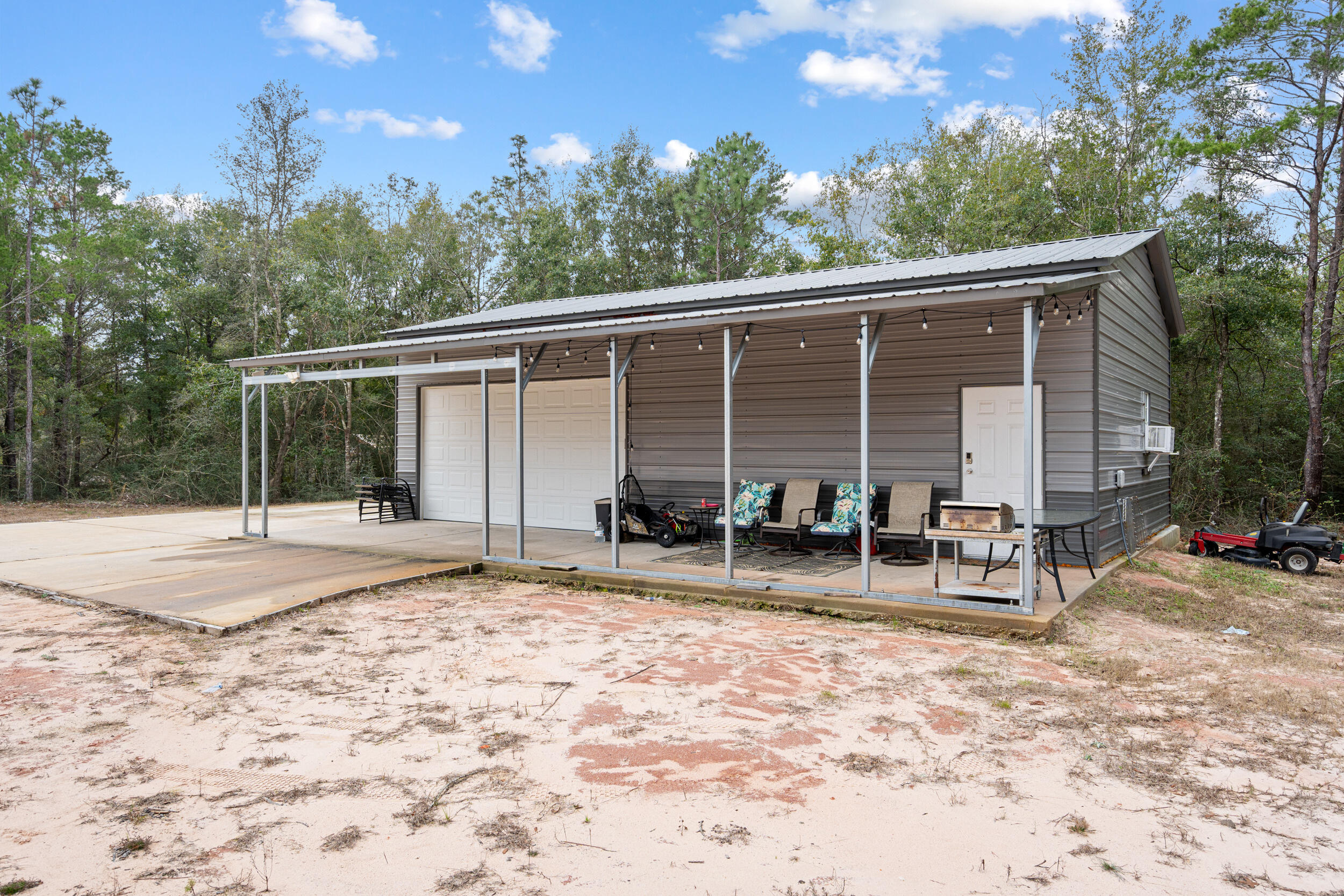 5570 Mt Olive Road Crestview, FL 32539 - Photo 45 of 57 a view of a house with backyard and sitting area
