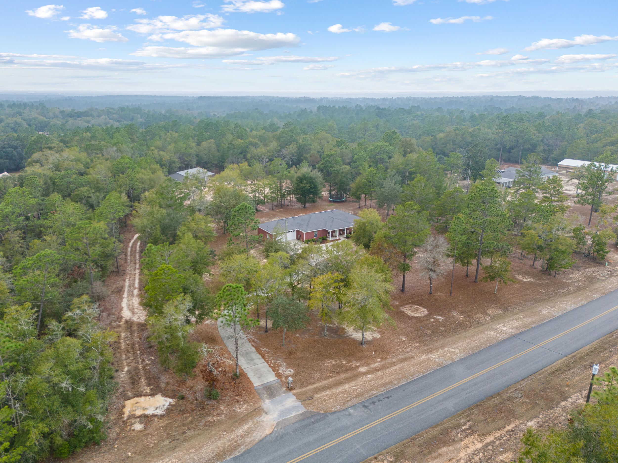 5570 Mt Olive Road Crestview, FL 32539 - Photo 46 of 57 a view of a yard with a street view
