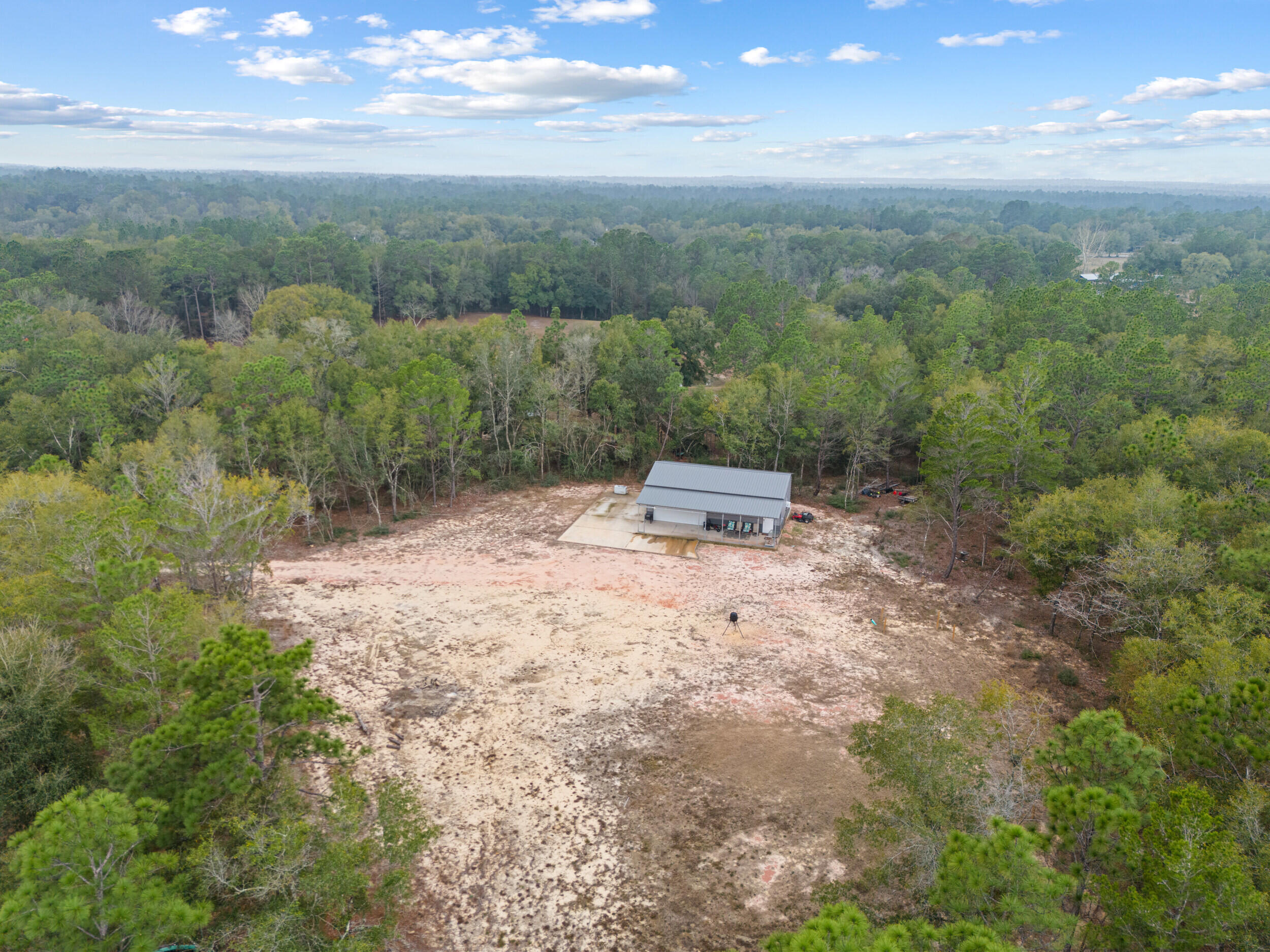 5570 Mt Olive Road Crestview, FL 32539 - Photo 49 of 57 a view of a city with lush green forest