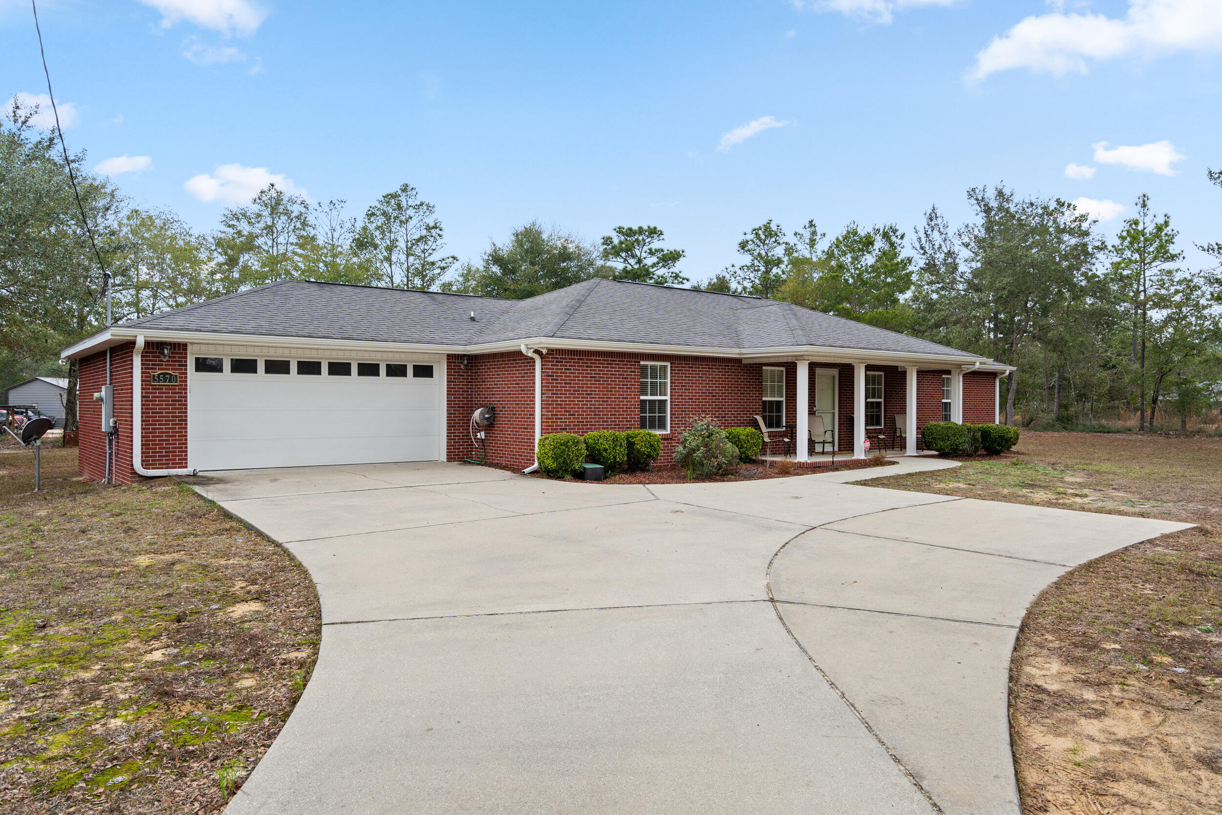 5570 Mt Olive Road Crestview, FL 32539 - Photo 7 of 57 a front view of a house with a yard