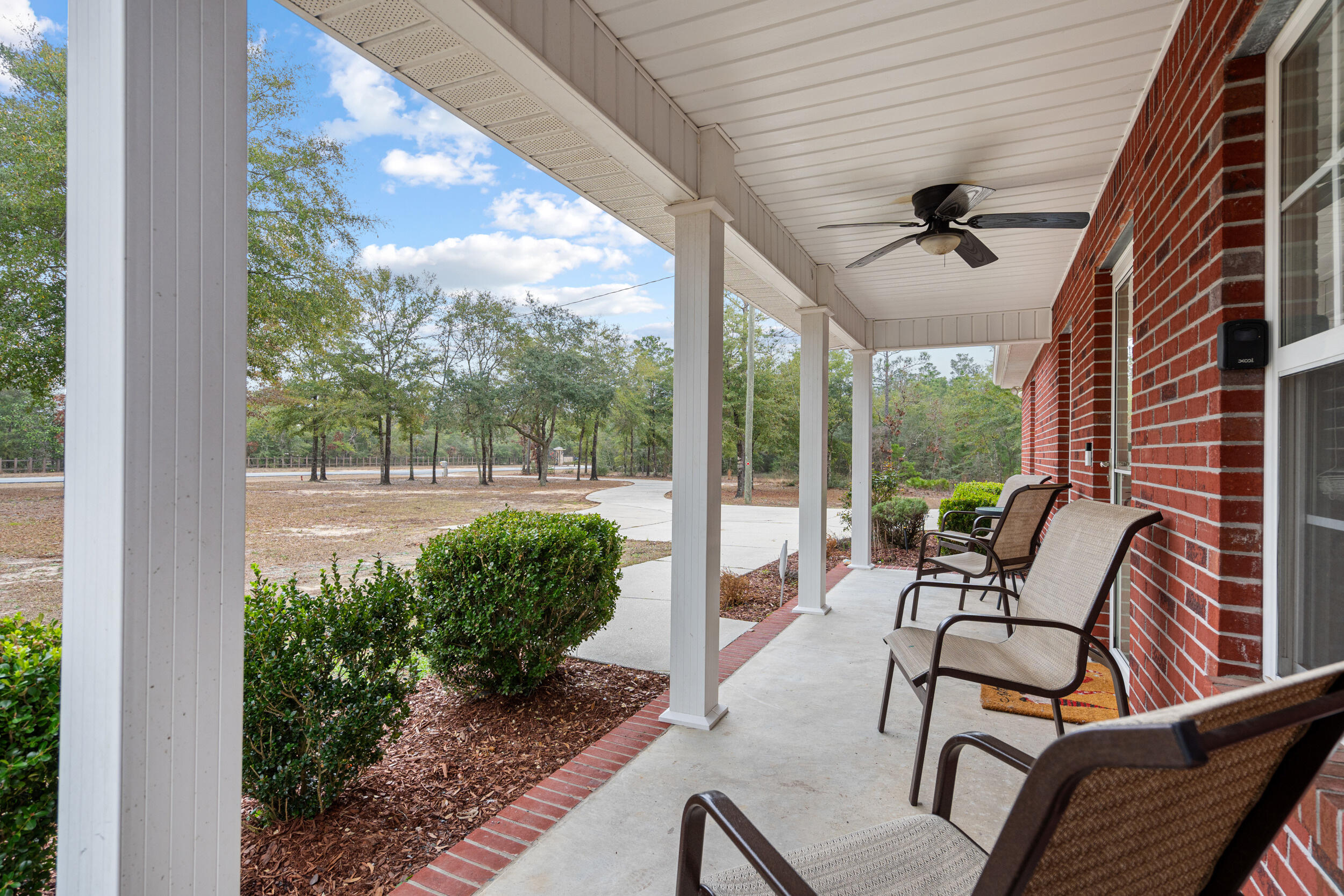 5570 Mt Olive Road Crestview, FL 32539 - Photo 10 of 57 a balcony with furniture and a potted plant
