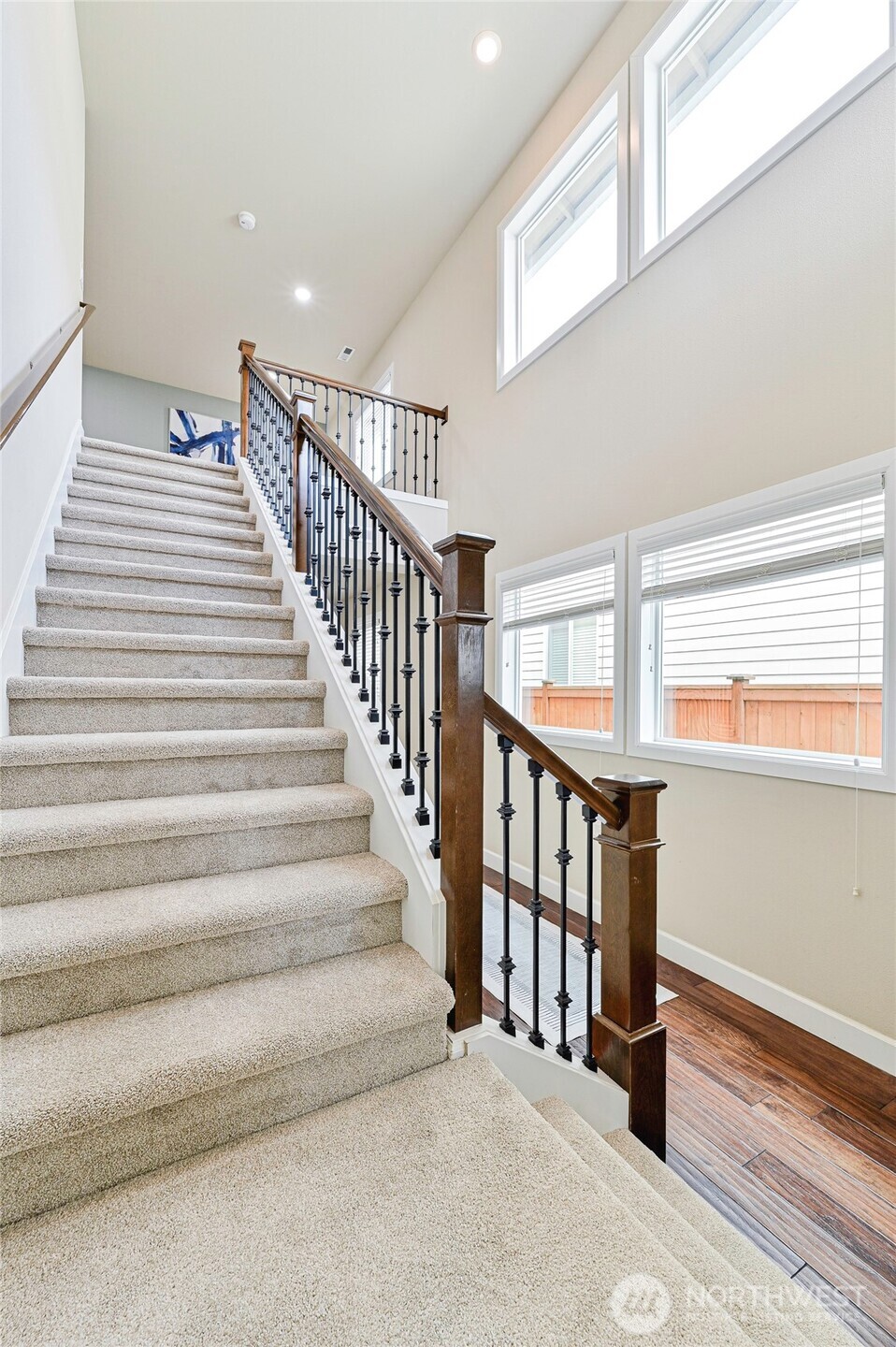 17312 40th Avenue Southeast Bothell, WA 98012 - Photo 15 of 34 a view of staircase with lots of frames on wall and a window