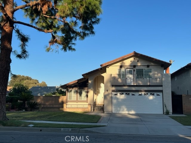 19616 Georgina Circle Cerritos, CA 90703 - Photo 1 of 16 a front view of a house with a yard
