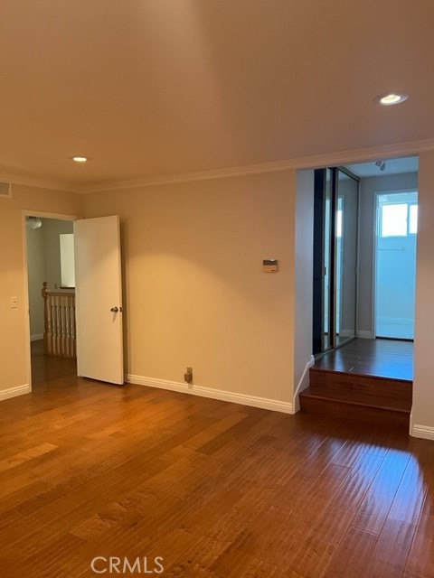 19616 Georgina Circle Cerritos, CA 90703 - Photo 11 of 16 a view of an empty room with wooden floor and a bathroom