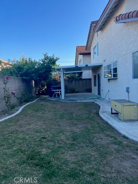 19616 Georgina Circle Cerritos, CA 90703 - Photo 15 of 16 front view of a house with a yard