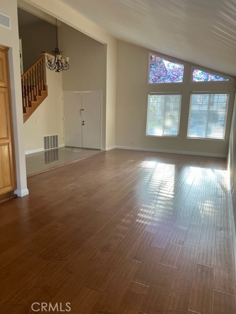 19616 Georgina Circle Cerritos, CA 90703 - Photo 3 of 16 an empty room with wooden floor and windows