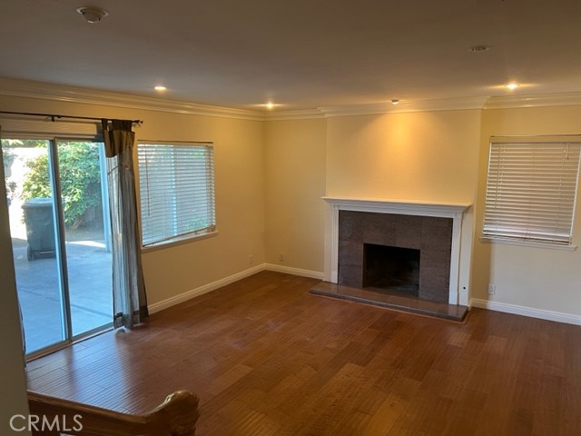 19616 Georgina Circle Cerritos, CA 90703 - Photo 6 of 16 a view of an empty room with a window and wooden floor