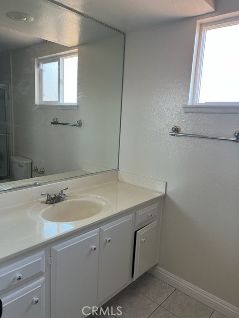 19616 Georgina Circle Cerritos, CA 90703 - Photo 10 of 16 a utility room with a sink vanity and a window