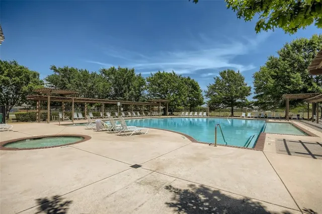 a view of swimming pool with a yard