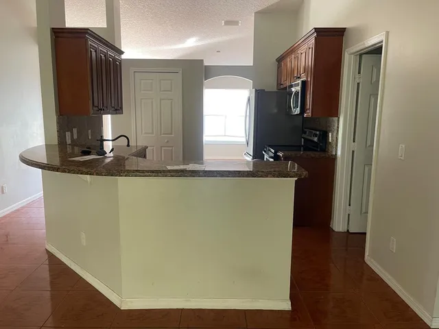 a bathroom with a sink a mirror and a shower
