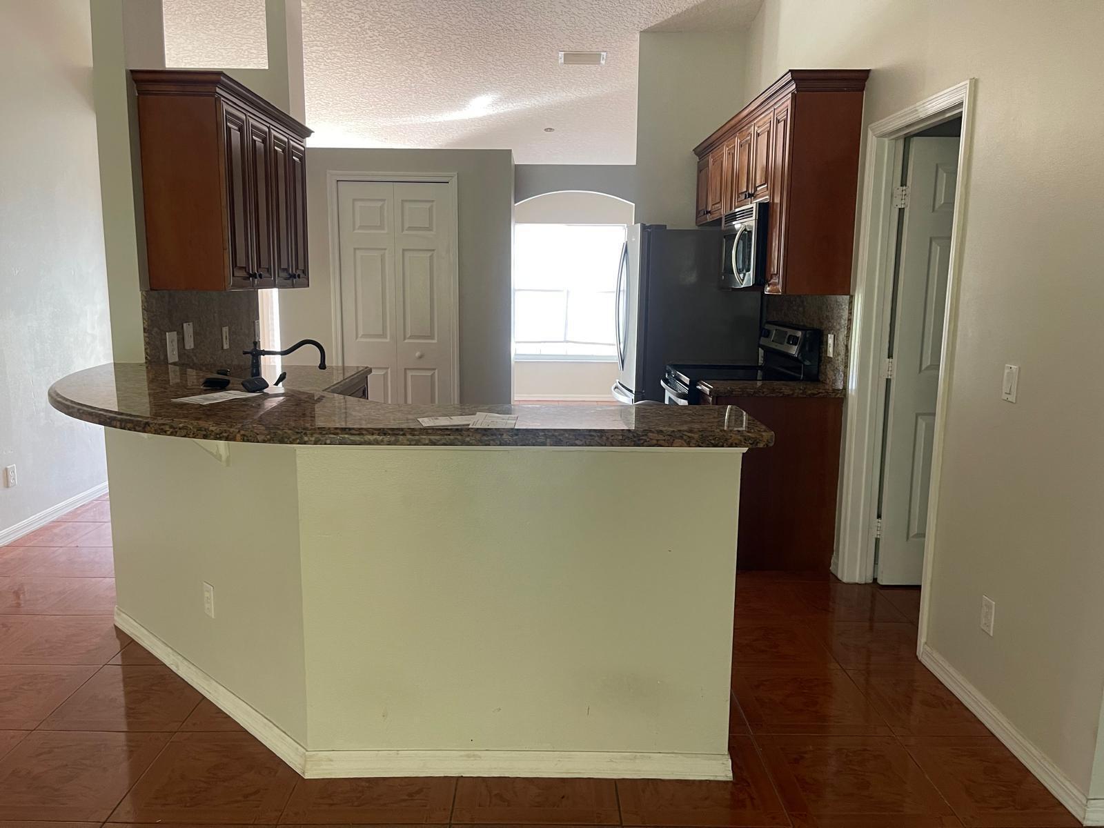 4397 Southwest Calah Circle Port St. Lucie, FL 34953 - Photo 5 of 10 a bathroom with a sink a mirror and a shower