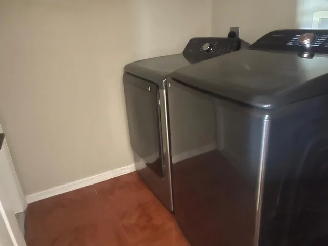 a utility room with dryer and washer