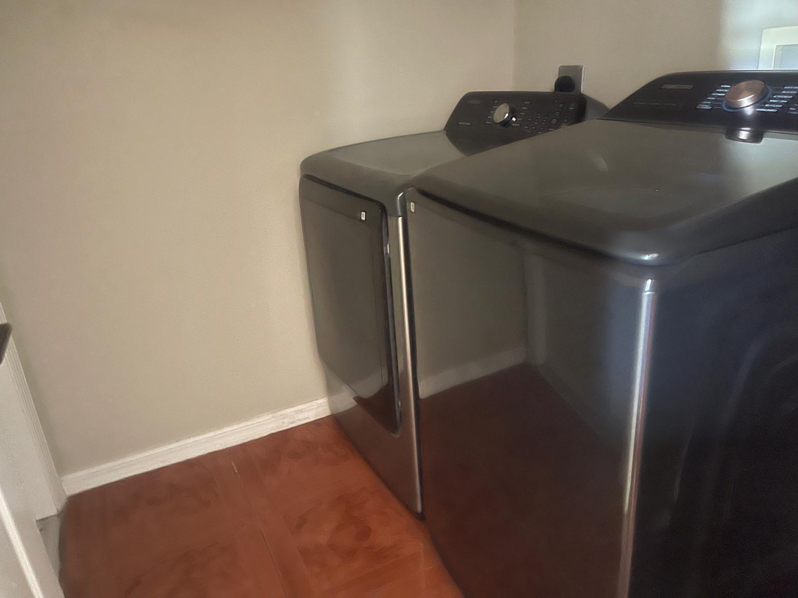 4397 Southwest Calah Circle Port St. Lucie, FL 34953 - Photo 7 of 10 a utility room with dryer and washer